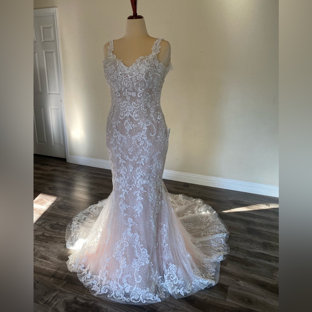 Maggie Sotero Couture. Size 10. Unused. Unaltered. Ivory champagne gown.